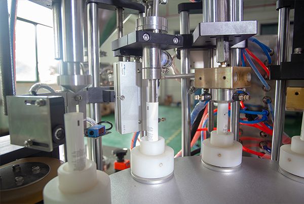 cosmetic tube filling and sealing machine